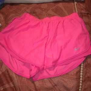 Hot pink Nike running shorts